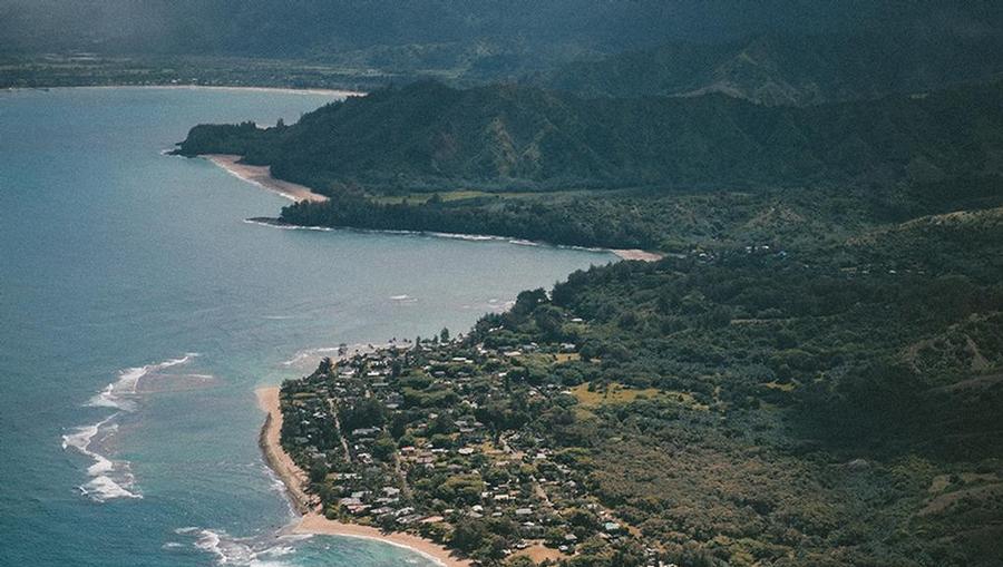 A bird’s eye view of the lush Maui coast from a helicopter.